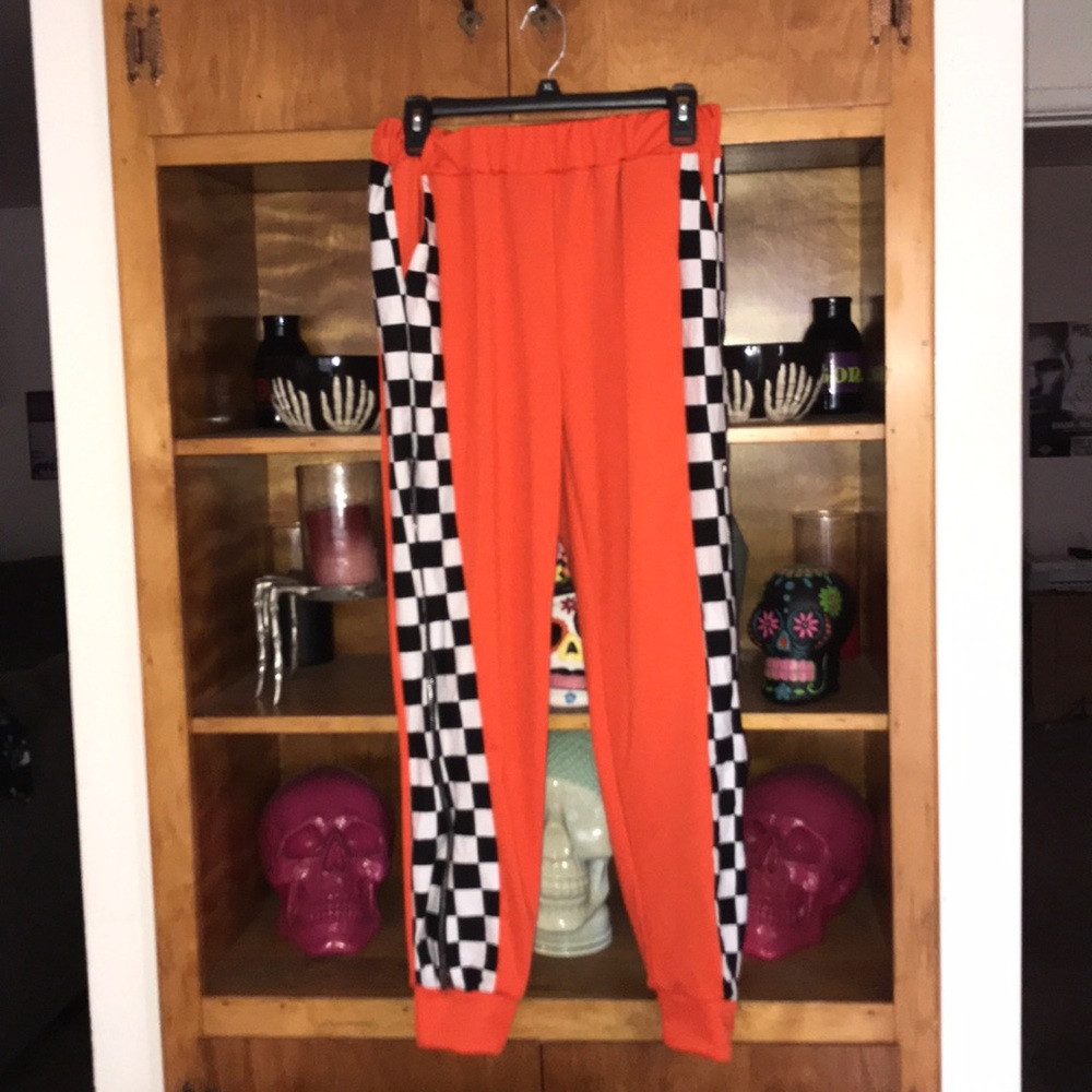 Orange and checkered stretch pants